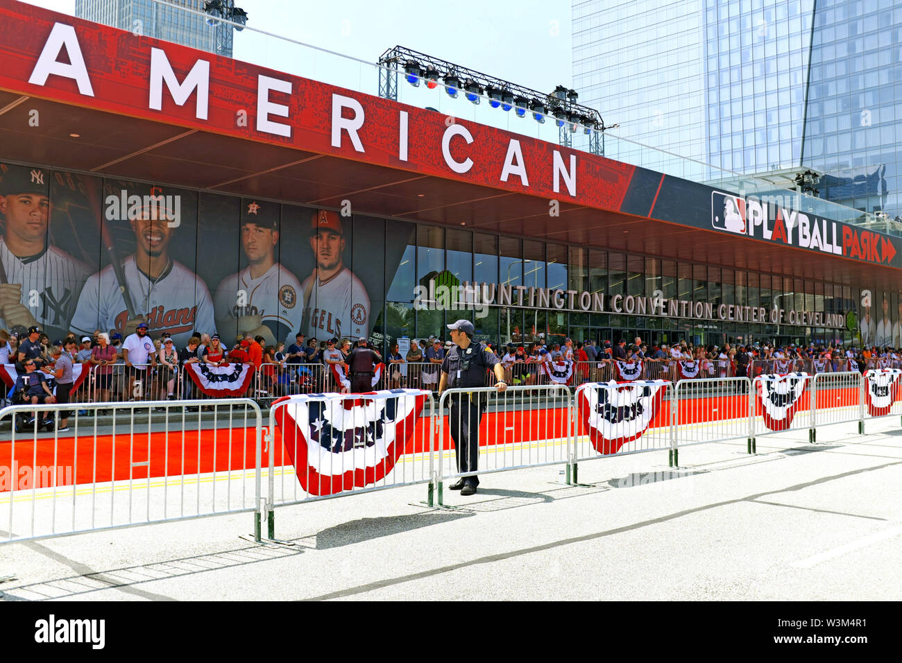 Crowds in front of the Cleveland Convention Center wait for the 2019 MLB All Star Game to commence on Lakeside Avenue in Cleveland, Ohio, USA. Stock Photo