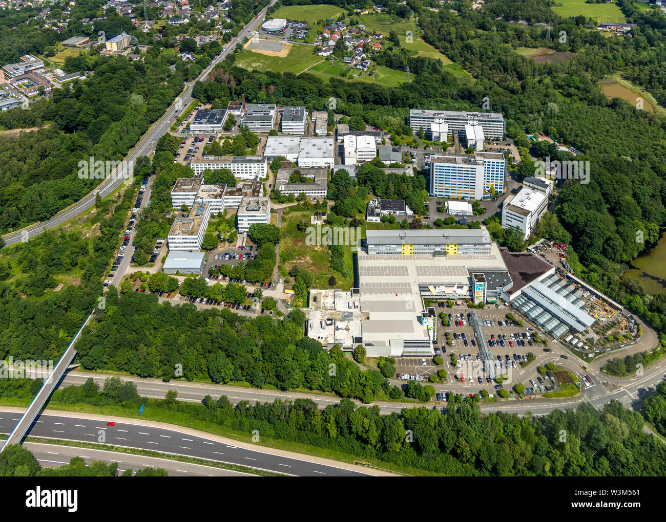 Aerial view of the commercial area Bensberg at the A4 motorway in Bergisch Gladbach in Bergisches Land in the state of North Rhine-Westphalia, Germany Stock Photo