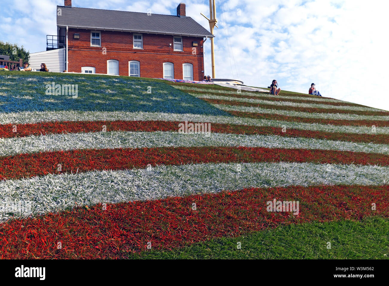 A large patriotic American flag is painted on a hillside in Fairport Harbor, Ohio, USA. Stock Photo