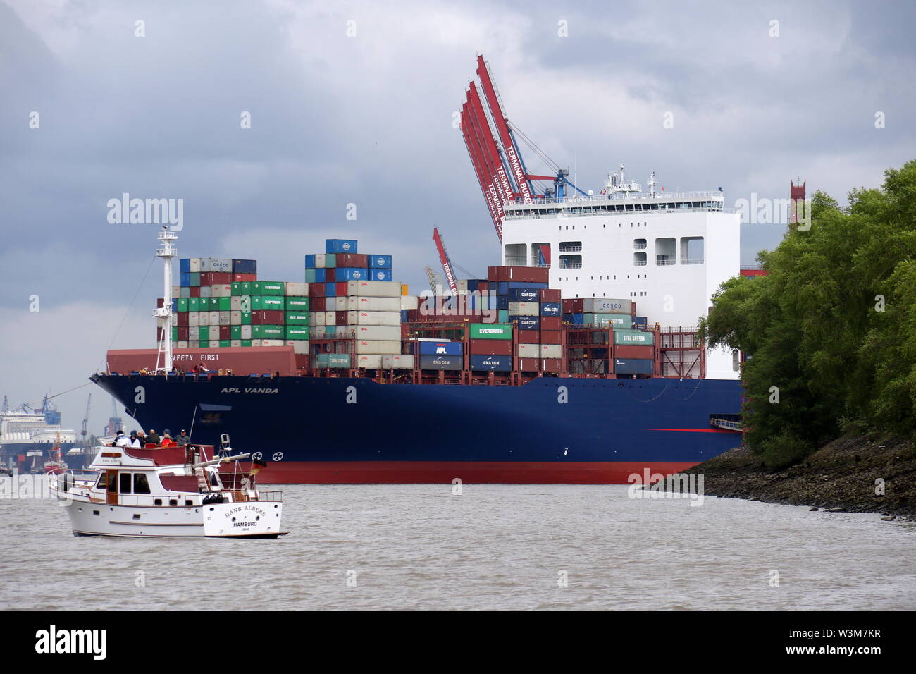 The container ship APL Vanda leaves the port of Hamburg on May 10, 2019. Stock Photo