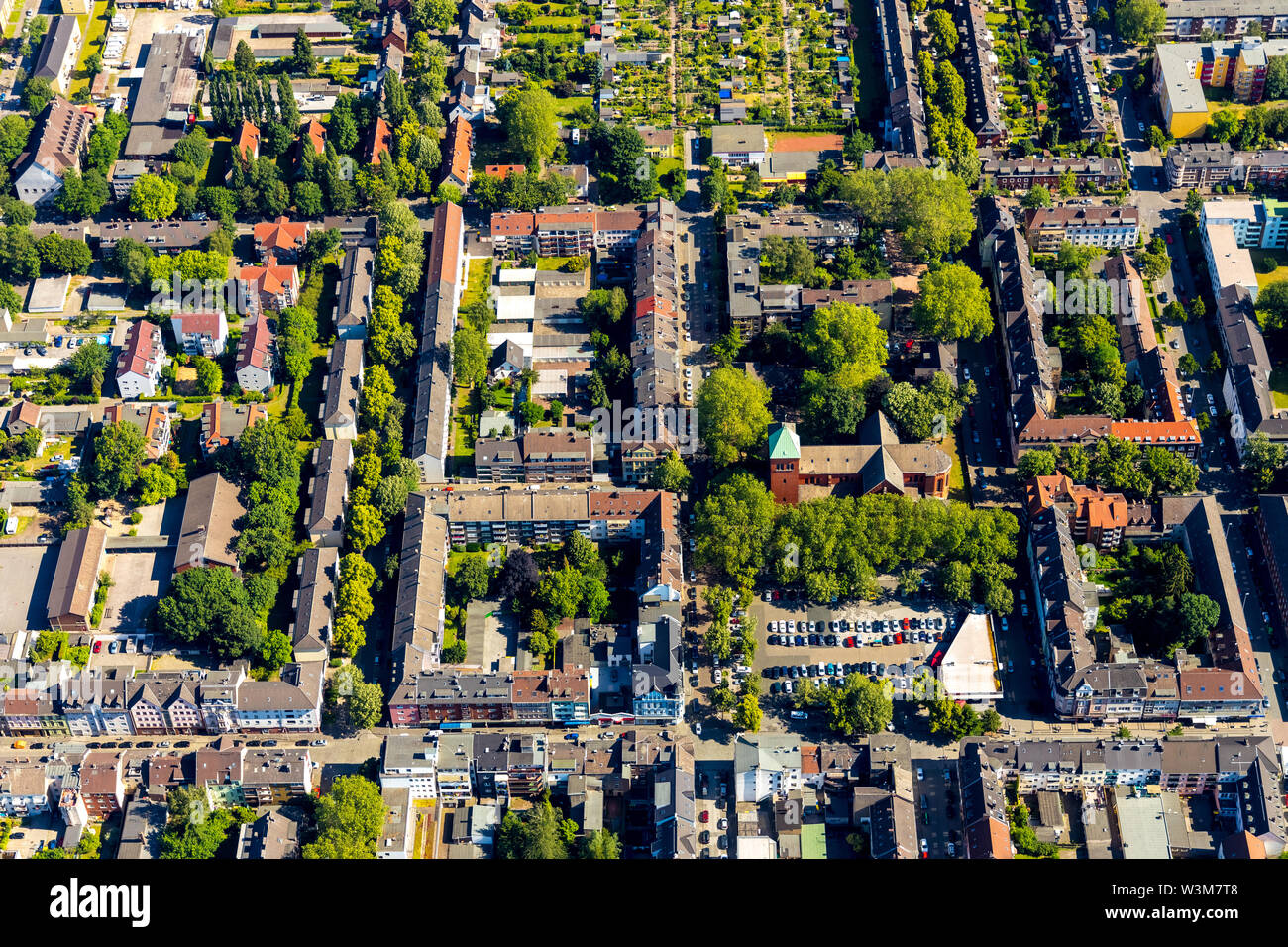 aerial photo of the catholic church St. Michael in Wanheimerort at Michaelplatz in Duisburg in the Ruhr area in the federal state Nordrhein.Westfalen Stock Photo