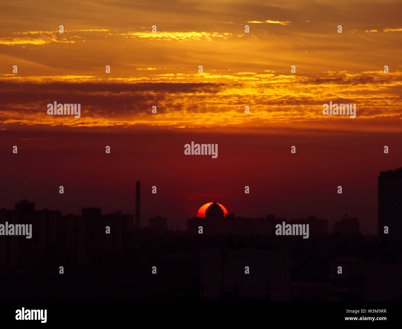 Sun rising over Kyiv city skyline, Ukraine Stock Photo