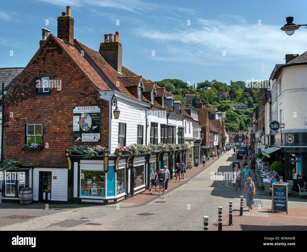 Pedestrianised Cliffe High Street with shops and shoppers on a sunny day in Summer, Lewes, East Sussex, England, UK Stock Photo