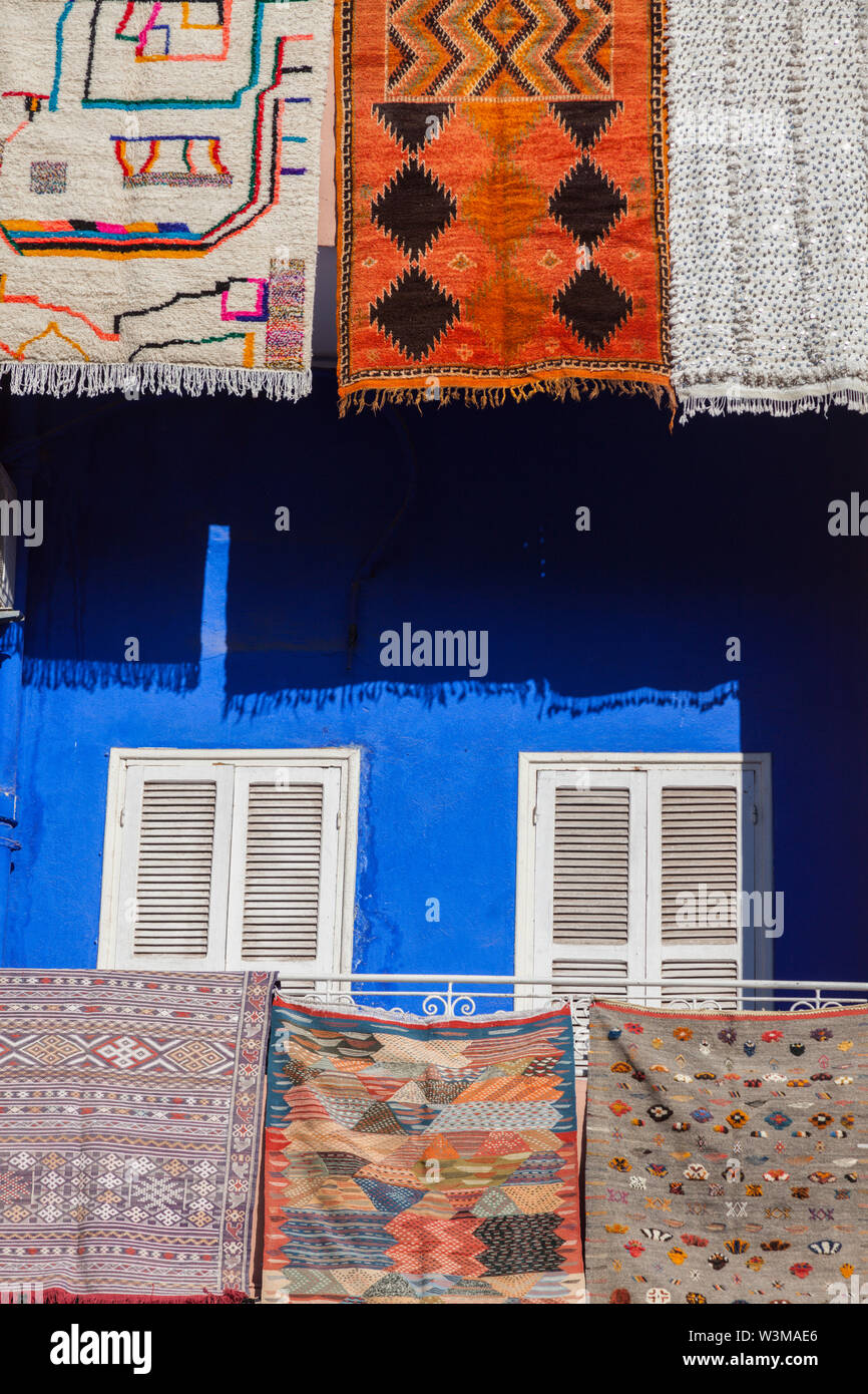 Rugs hanging from balconies in Marrakesh, Morocco Stock Photo