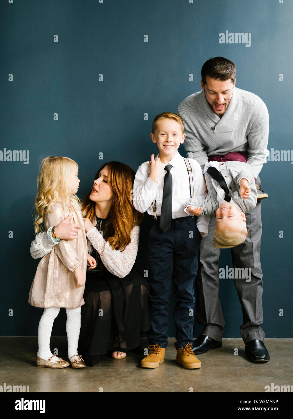 Well-dressed family with three children Stock Photo