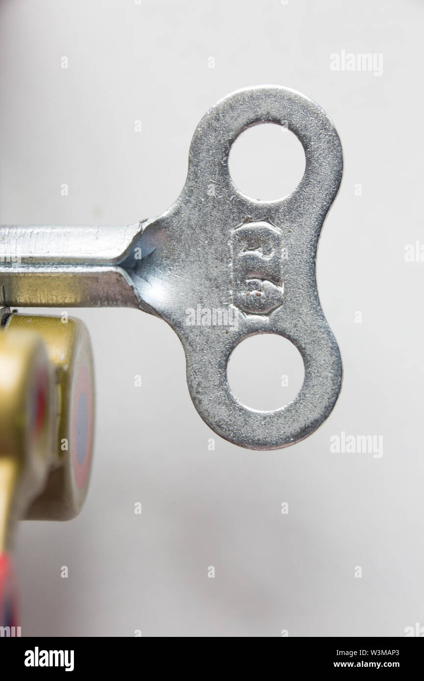 Close up shot of winding key of vintage tin toy robot Stock Photo