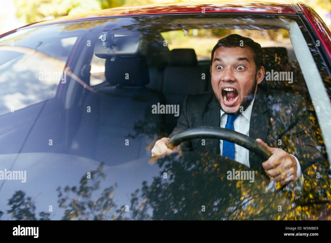 Shocked driver in the car, frightened man driving Stock Photo Alamy