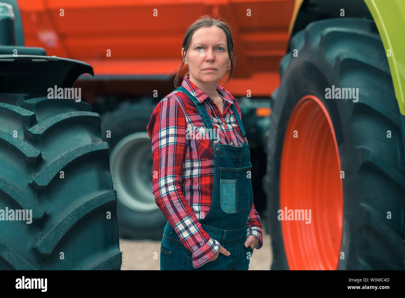 Farmer posing with tractor hires stock photography and images Alamy