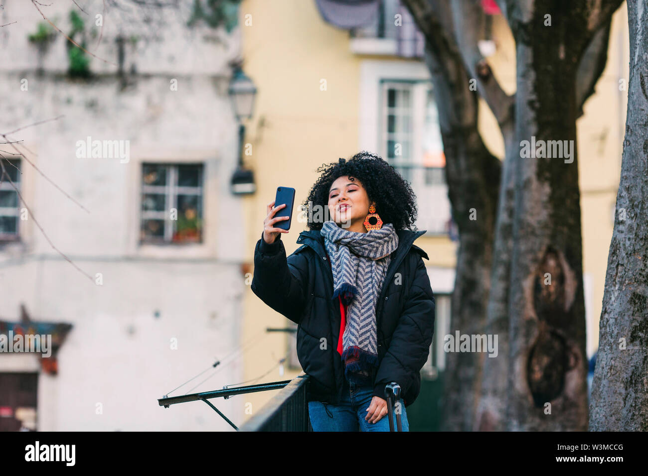 Young woman taking selfie in Lisbon, Portugal Stock Photo