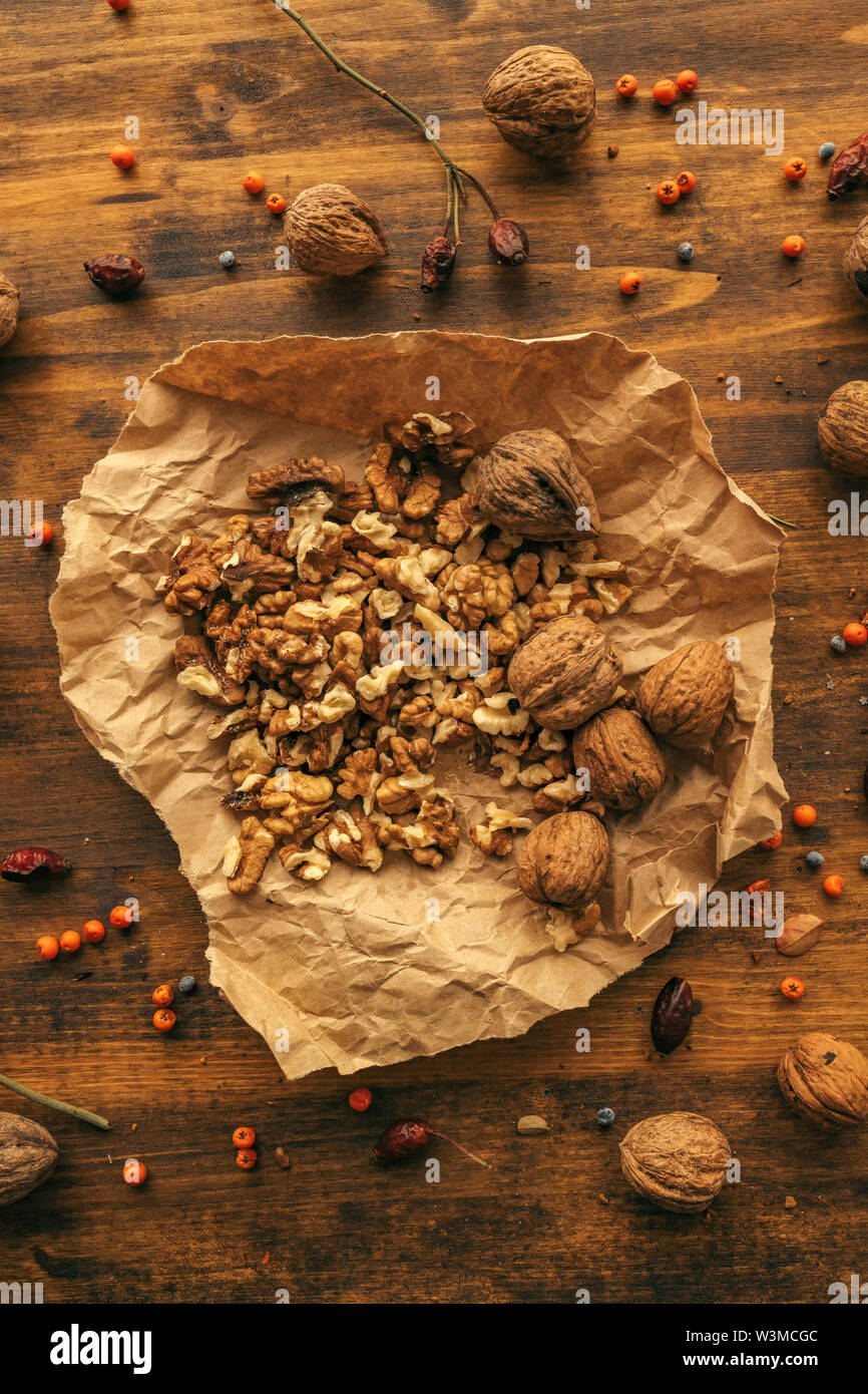 Walnut kernels in crumpled paper top view Stock Photo