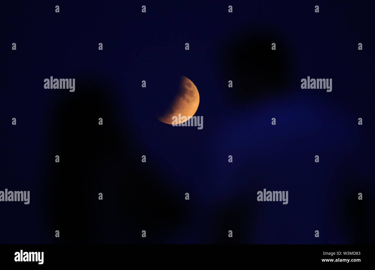 A partial lunar eclipse is visible above London on the 50th anniversary ...