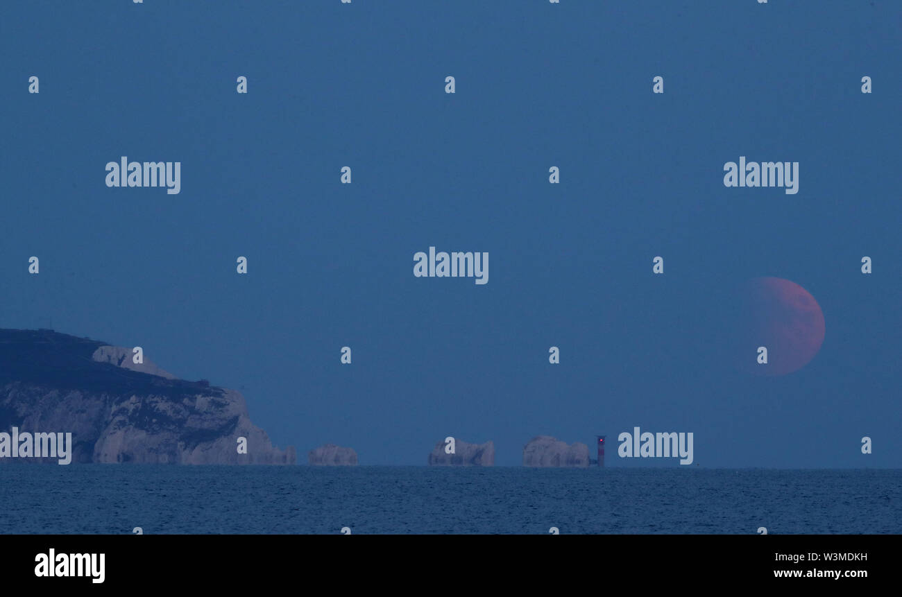 A partial lunar eclipse is visible over the Needles as seen from Avon ...
