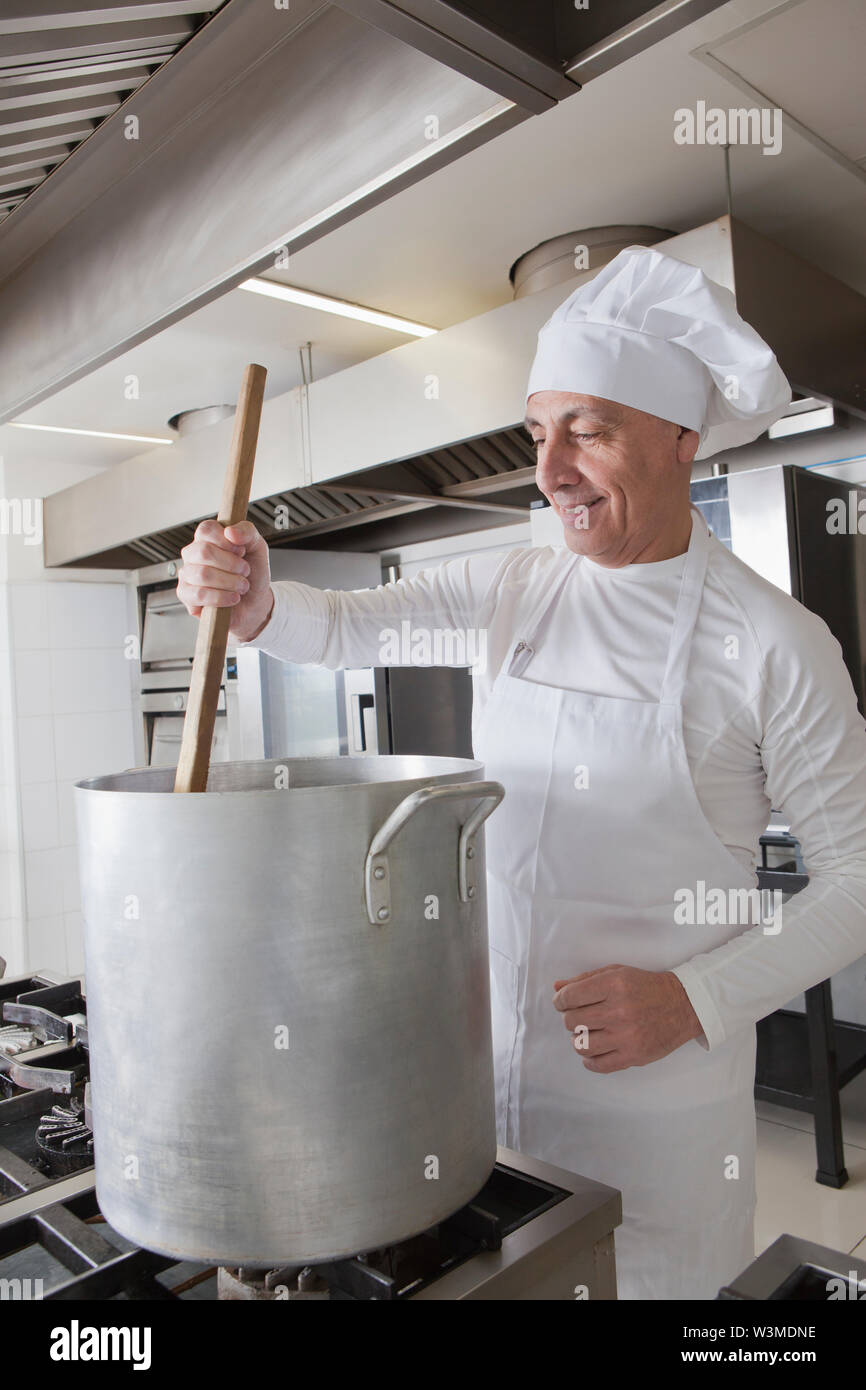 Man stirring pot hi-res stock photography and images - Alamy