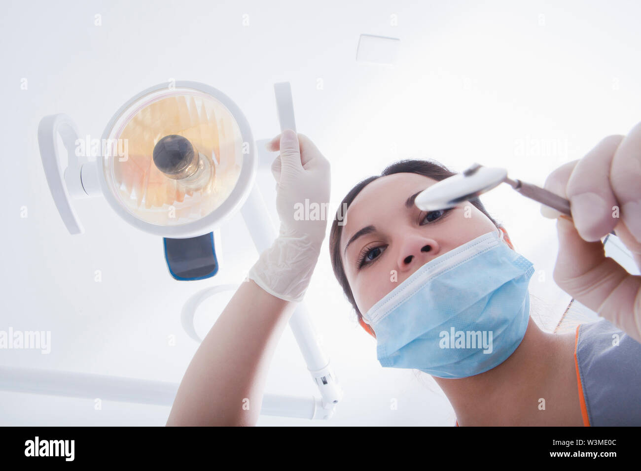 View directly below dental hygienist during examination Stock Photo