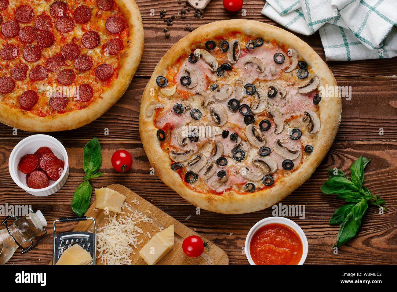 Pepperoni and mushroom pizzas with ingredients Stock Photo Alamy