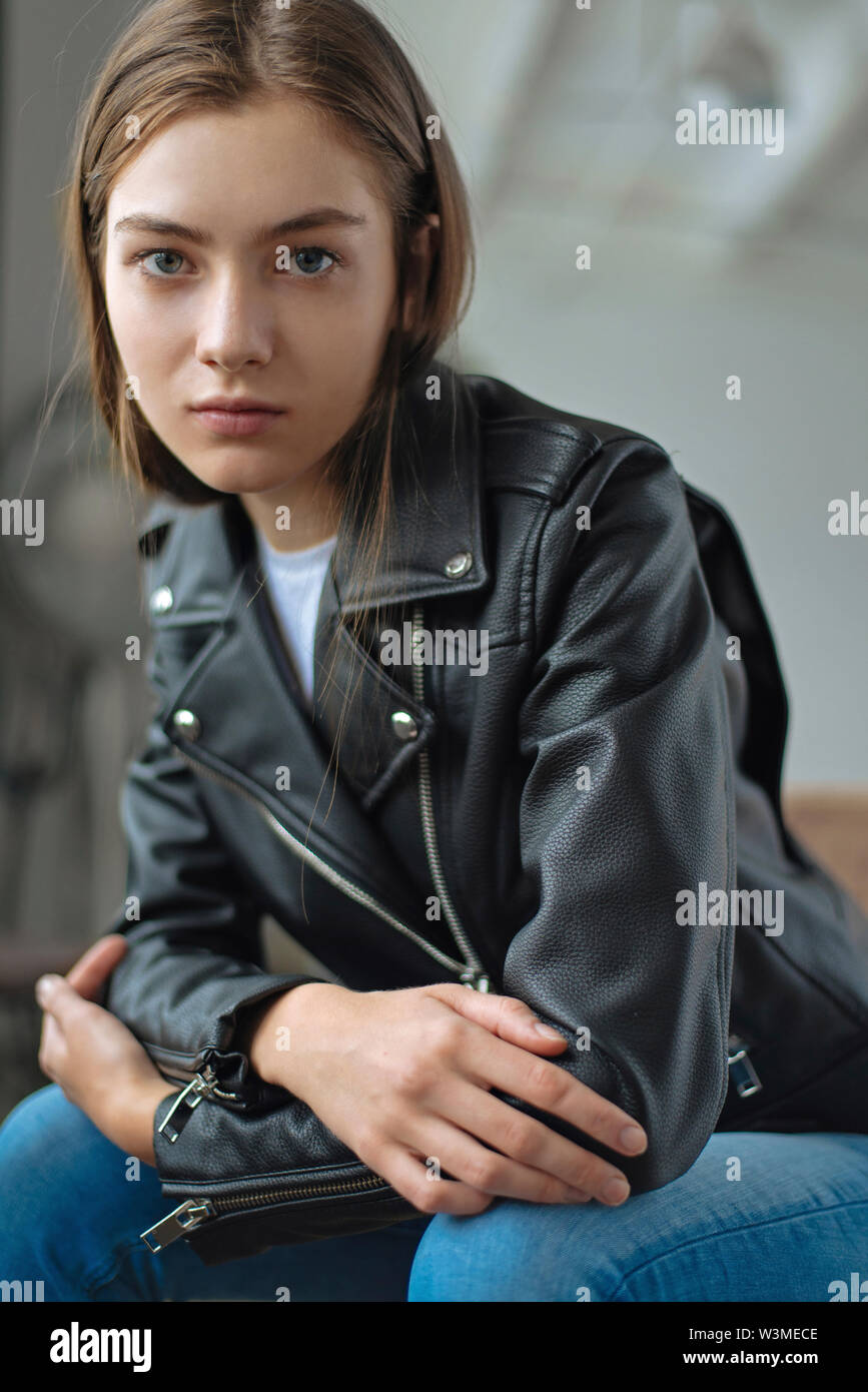 Young woman wearing black leather jacket Stock Photo - Alamy