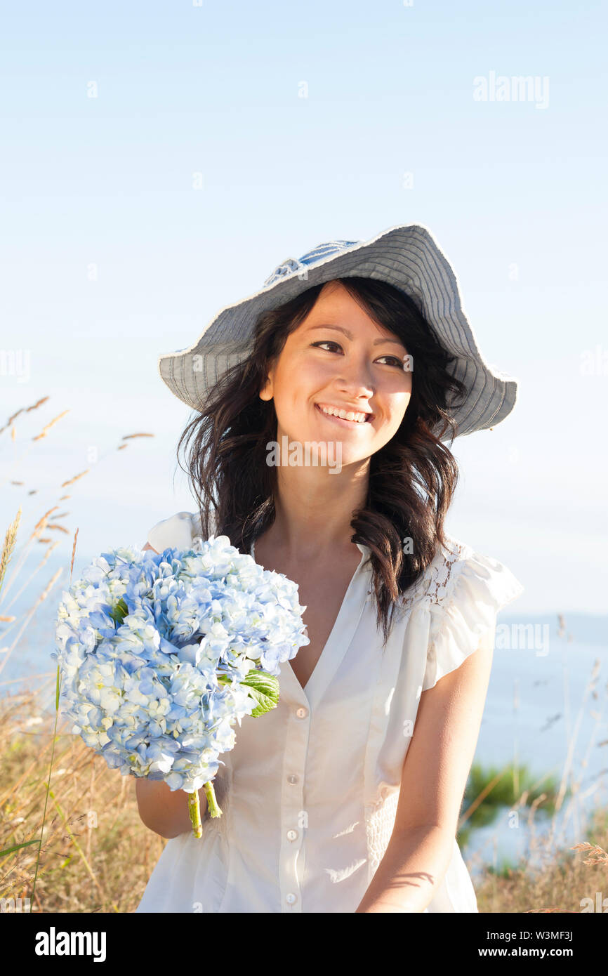 feminine dress and sun hat. Natural 