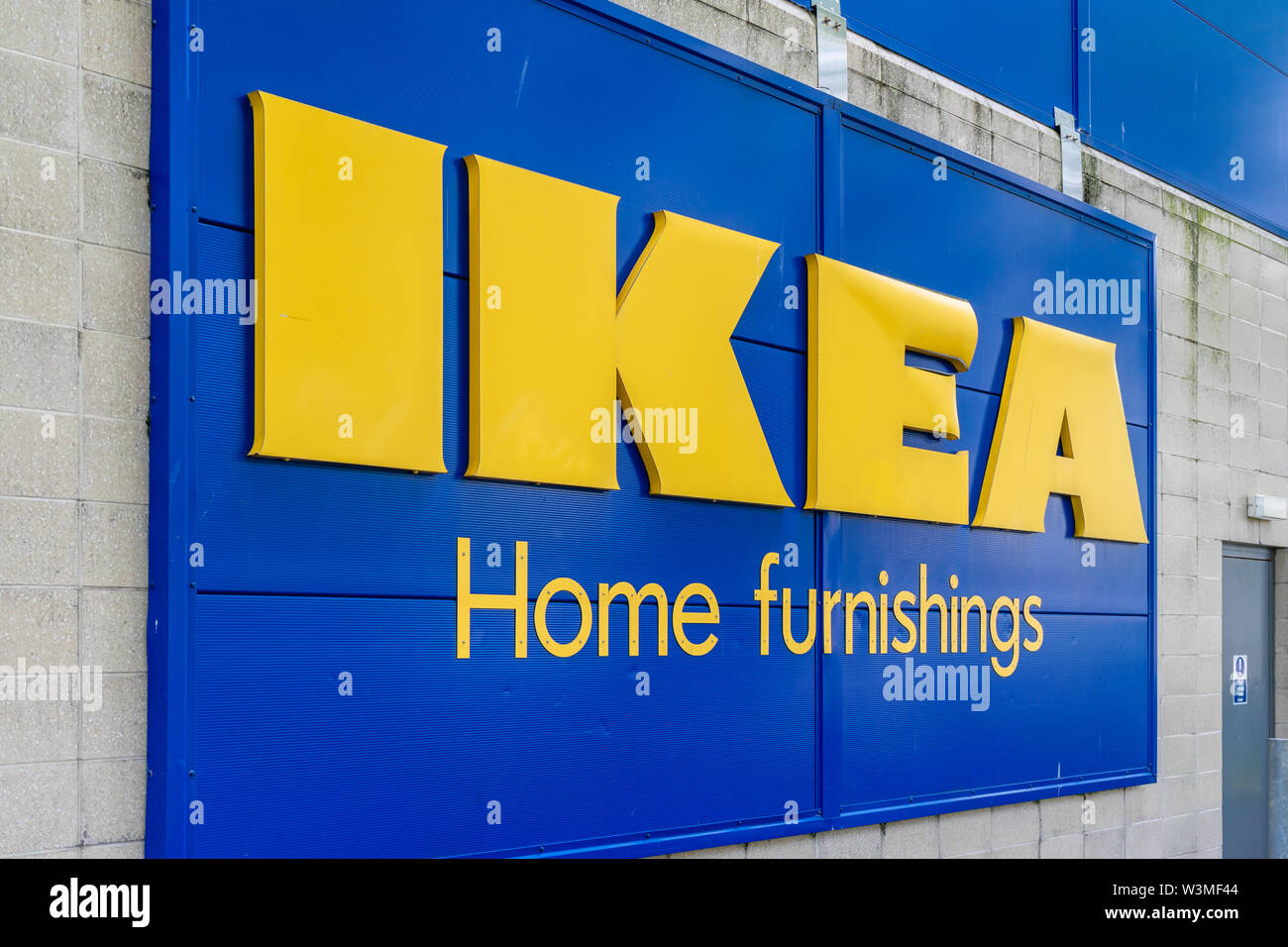 Blue and yellow IKEA Home furnishings sign outside an IKEA store in England, UK Stock Photo