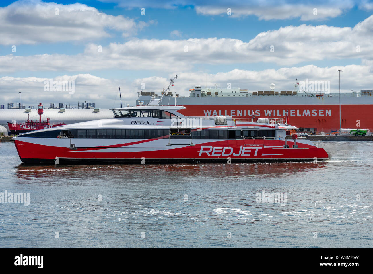 High-speed foot passenger catamaran Red Jet 6 owned by the Red Funnel ferry company arriving at Town Quay in the port of Southampton, England, UK Stock Photo