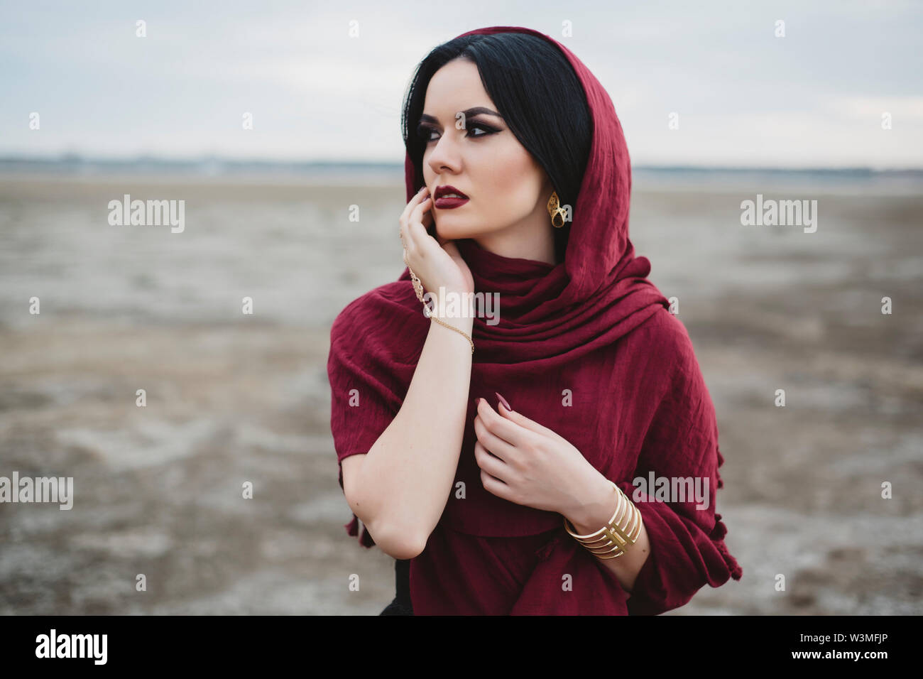 Woman wearing red headscarf and lipstick Stock Photo