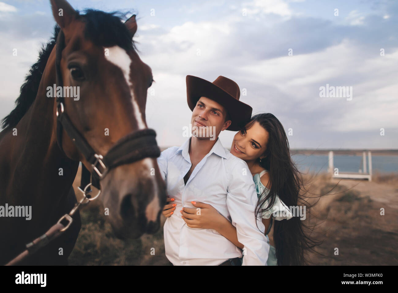 Young couple by horse Stock Photo