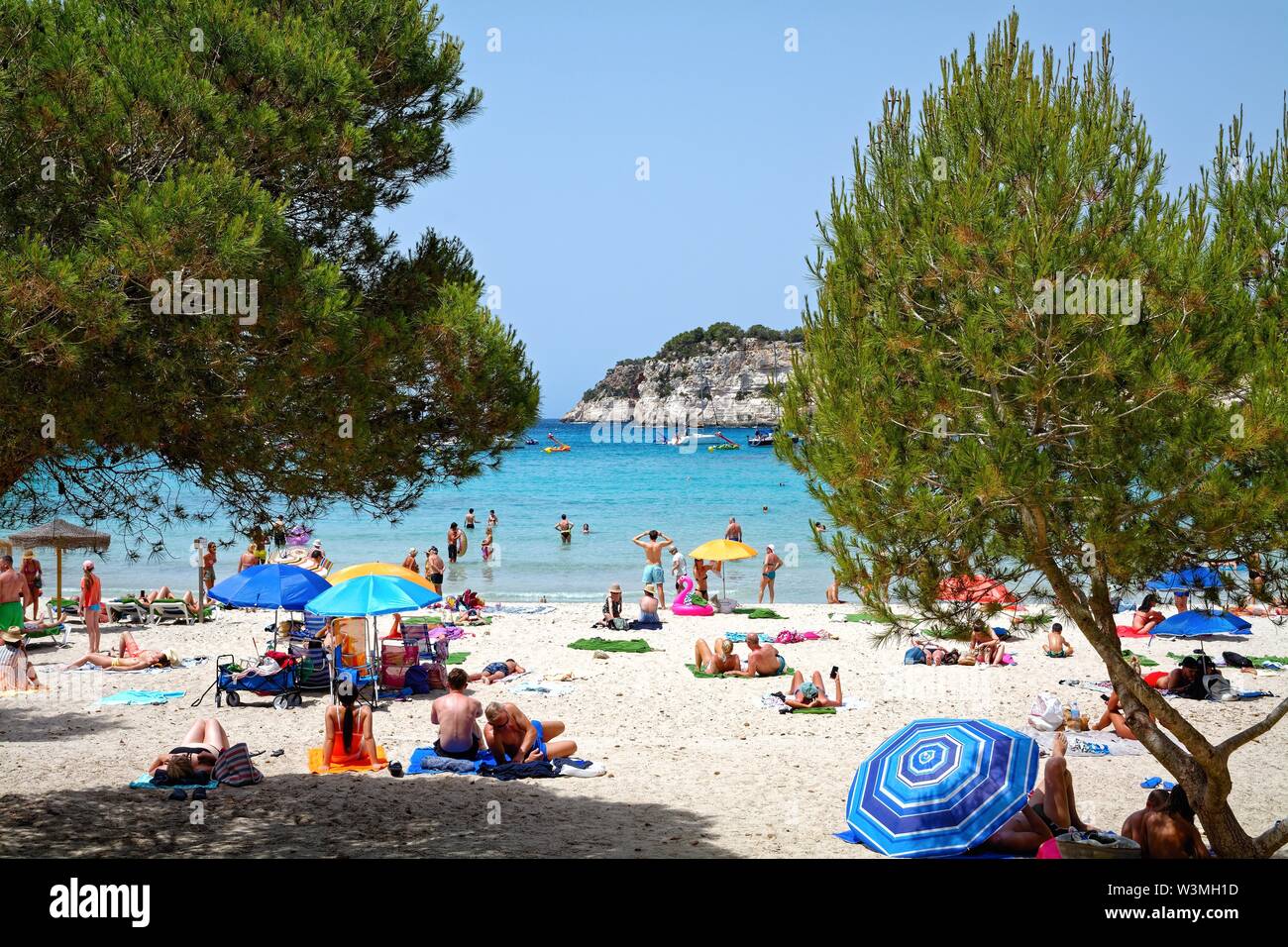 The beach at Cala Galdana on a hot sunny day  Menorca , Balearic Islands Spain Europe Stock Photo