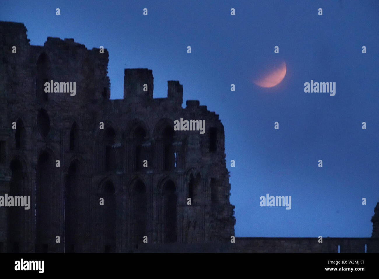 A partial lunar eclipse is visible above Tynemouth Priory, on the 50th ...