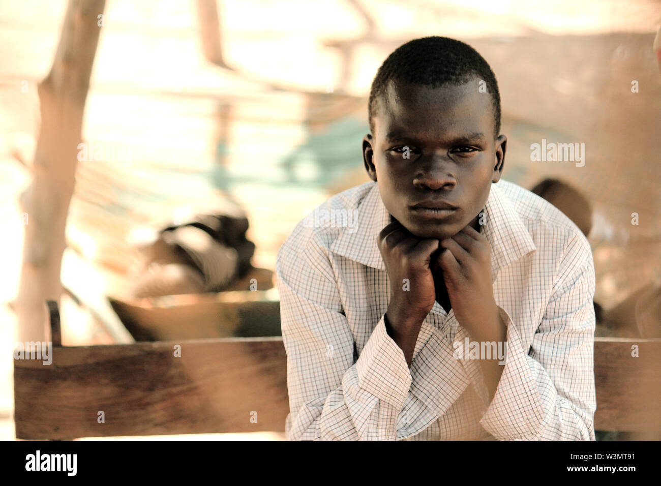At Sangere in Girei, Adamawa state, are students and pupils some of whom have lost either one or both of their parents to insurgency. At the same location, one of such victims poses for a personal portrait. Stock Photo