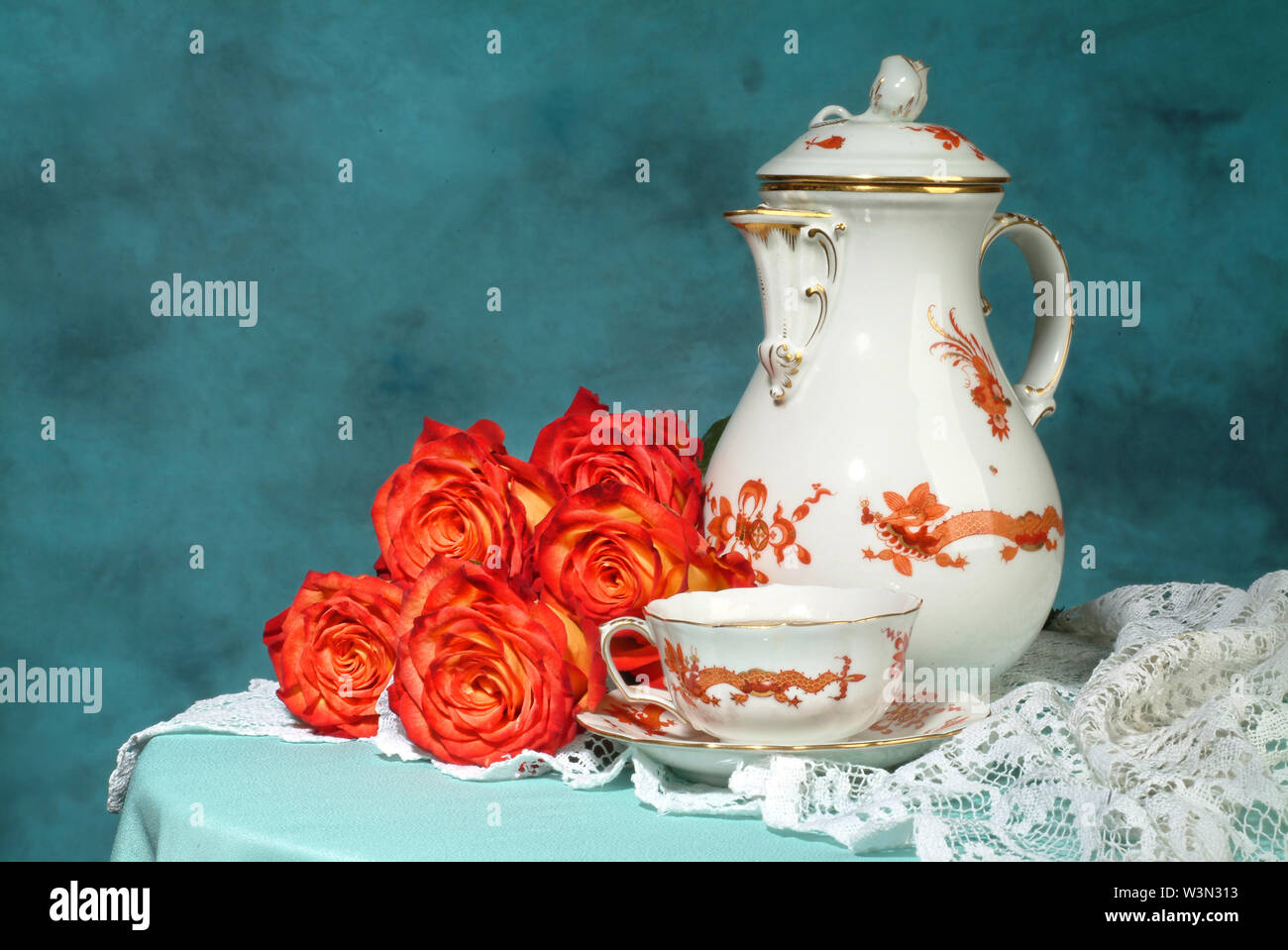 Tea set and bouquet of flowers on a studio background Stock Photo - Alamy