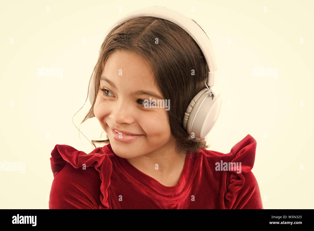 Girl Little Child Use Music Modern Headphones Listen For Free New And Upcoming Popular Songs Right Now Music Always With Me Little Girl Listen Music Wireless Headphones Online Music Channel Stock Photo alamy