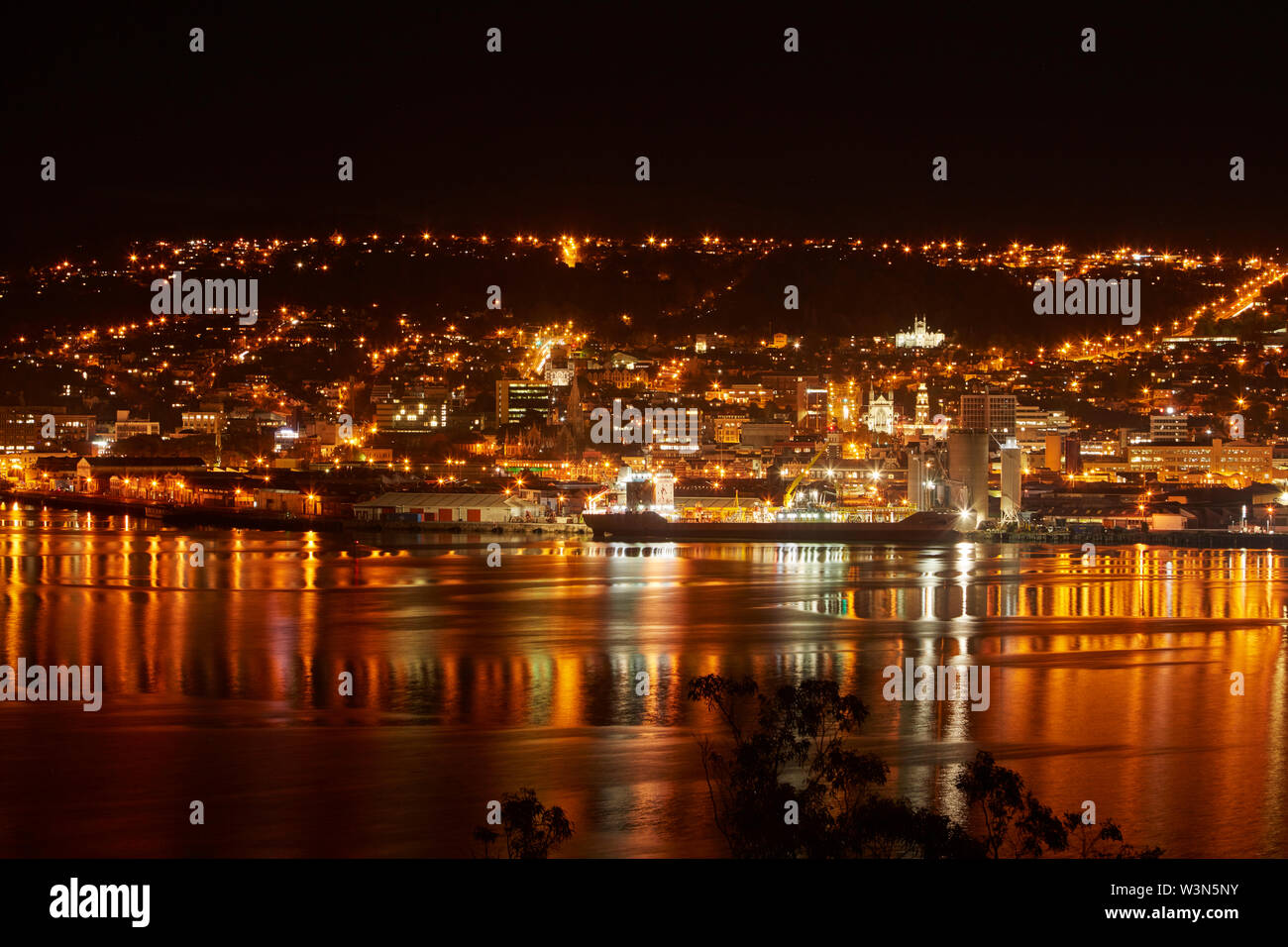 Dunedin city reflected in Otago Harbour, Otago, South Island, New Zealand Stock Photo