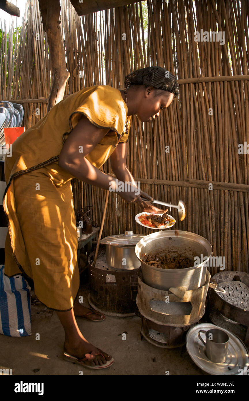 A young girl runs a restaurant cum bar, in Juba, the capital of South