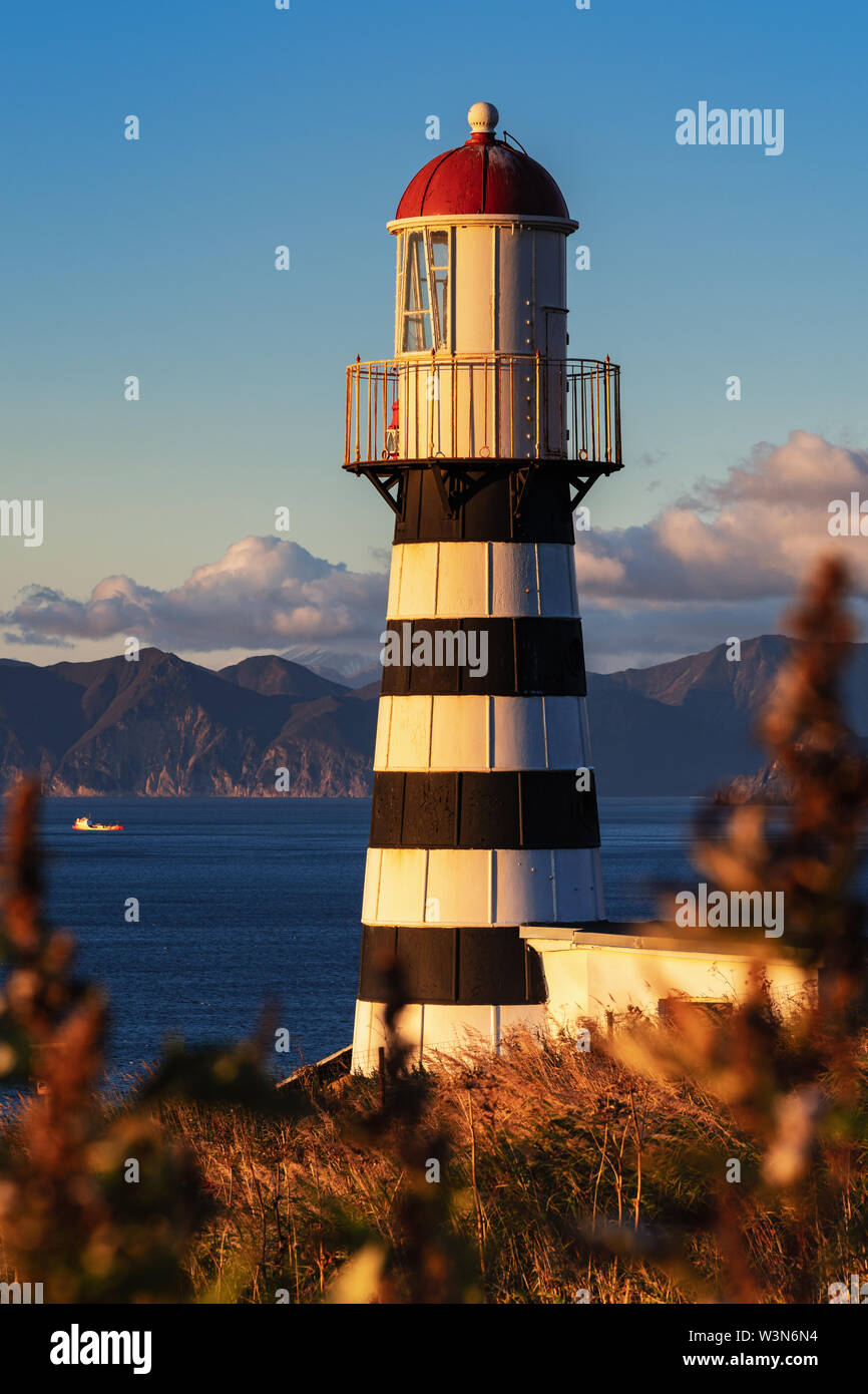 View of Petropavlovsky Lighthouse (founded in 1850) located on Kamchatka Region on shore of Avacha Gulf in Pacific Ocean, vicinity of Petropavlovsk-Ka Stock Photo