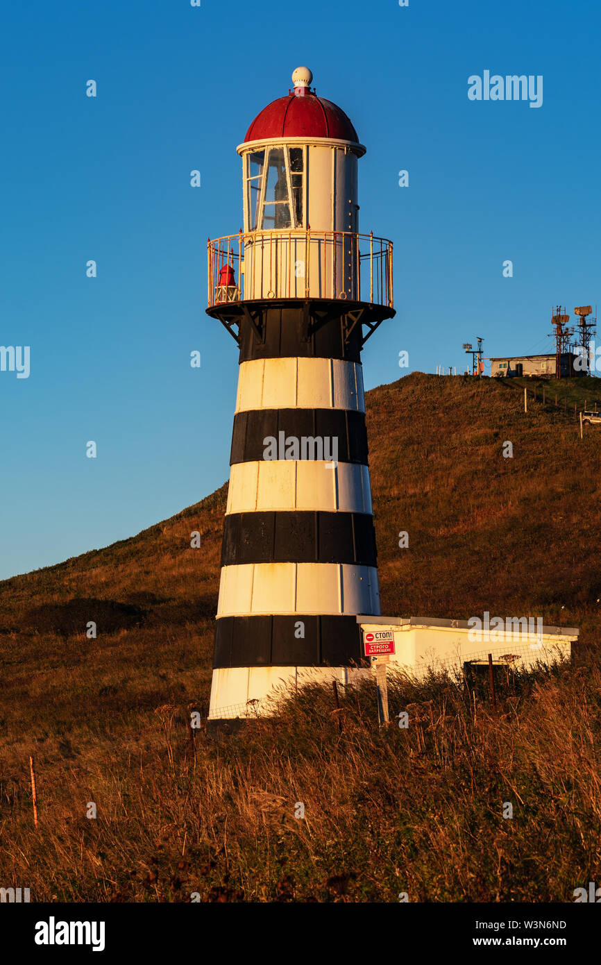 Morning view of Petropavlovsky Lighthouse - oldest lighthouse in Russian Far East (founded in 1850), located on Kamchatka Territory on shore of Pacifi Stock Photo