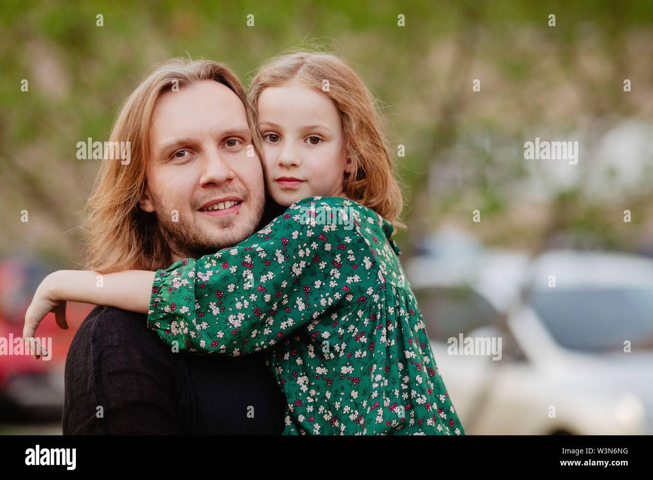 Man holding girl in his arms hi-res stock photography and images - Alamy