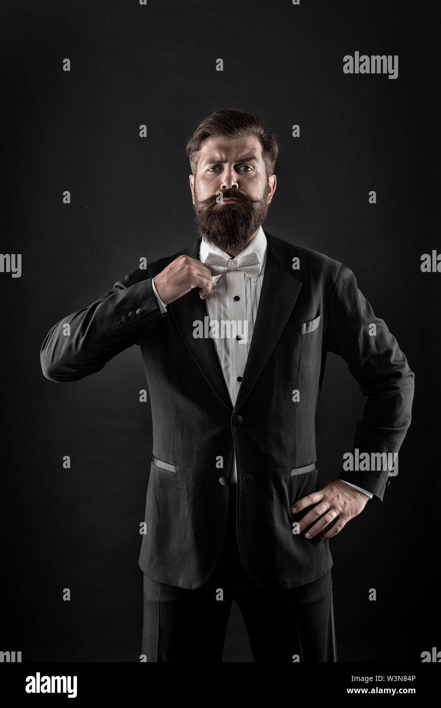 Hipster formal suit tuxedo. Difference between vintage and classic.  Official event dress code. Classic style. Menswear classic outfit. Bearded  man with bow tie. Well dressed and scrupulously neat Stock Photo - Alamy