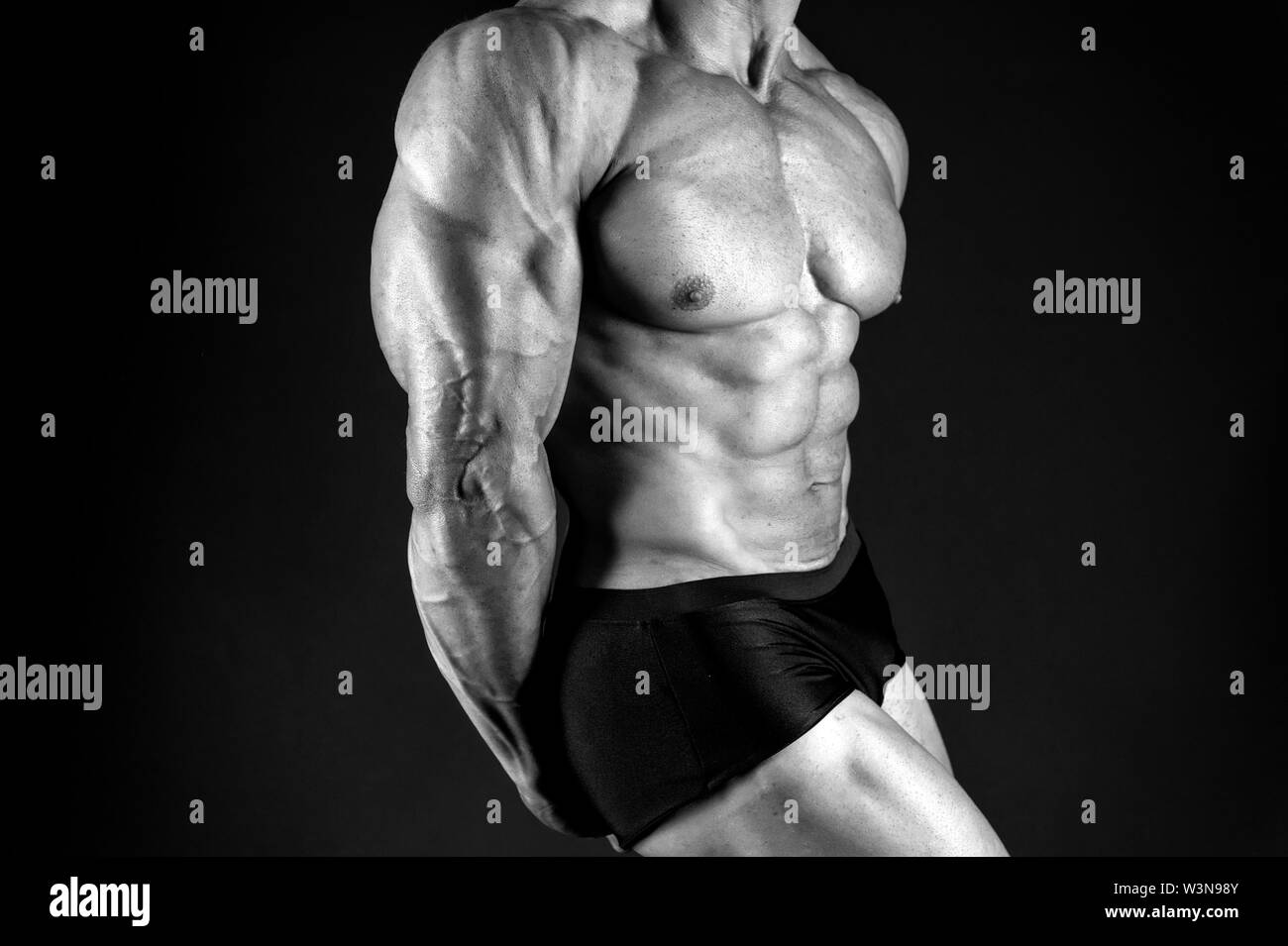 Strong muscles and power. male body. muscular macho man. diet and fitness. sport as healthy lifestyle. bodybuilder workout in gym. man take steroids and anabolic. muscular male body. strong male body ...