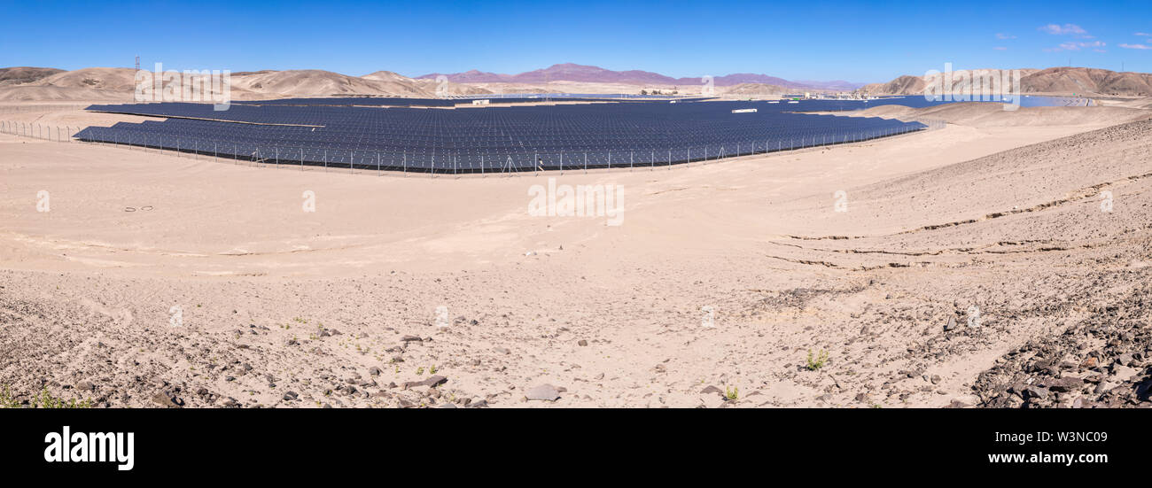 Solar Energy Photovoltaic Power Plant over Atacama desert sands, Chile. Sustainability and green energy from the sun with Solar Energy in the desert Stock Photo