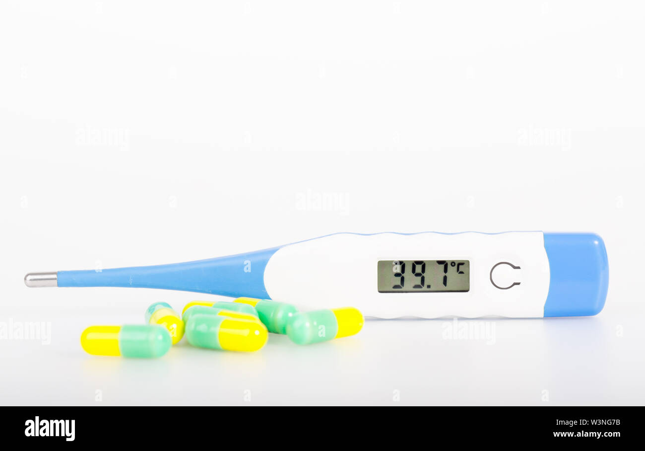 thermometer with drug on white Stock Photo Alamy