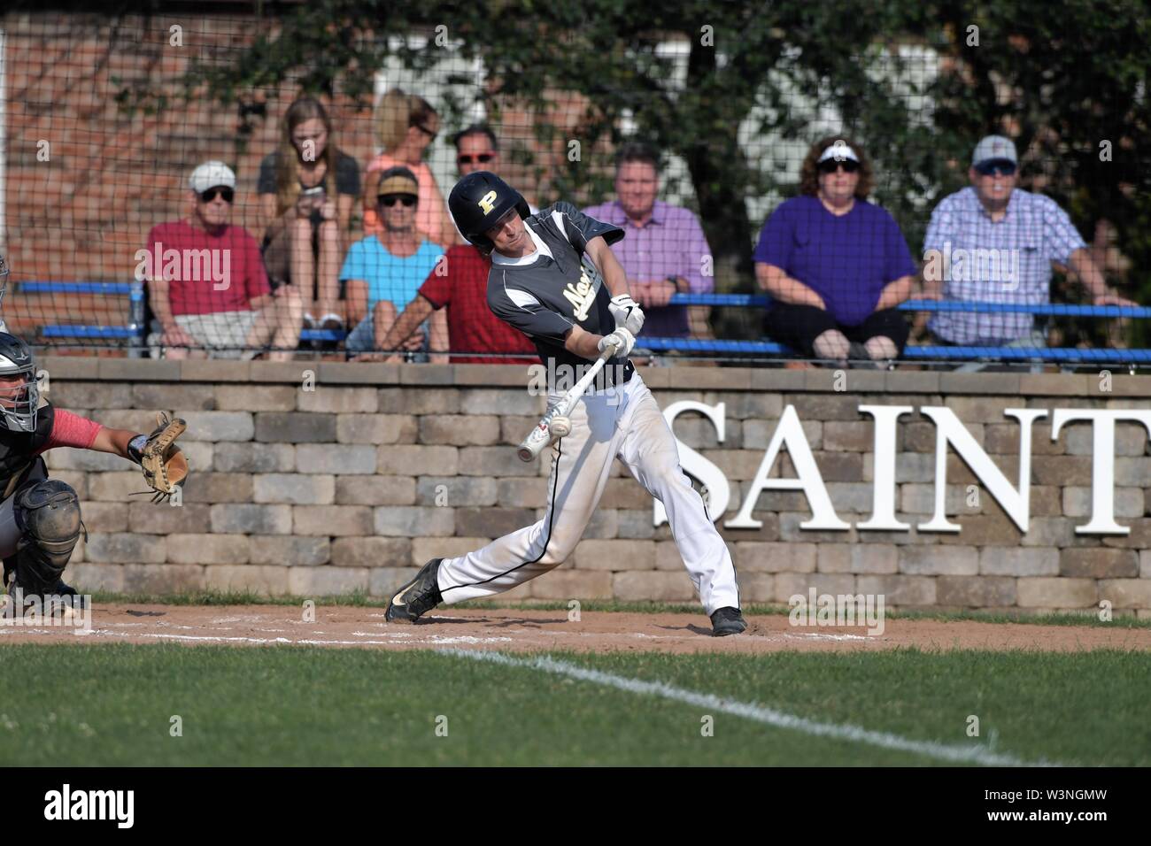 Batter making solid contact that resulted in a double to left field. USA. Stock Photo