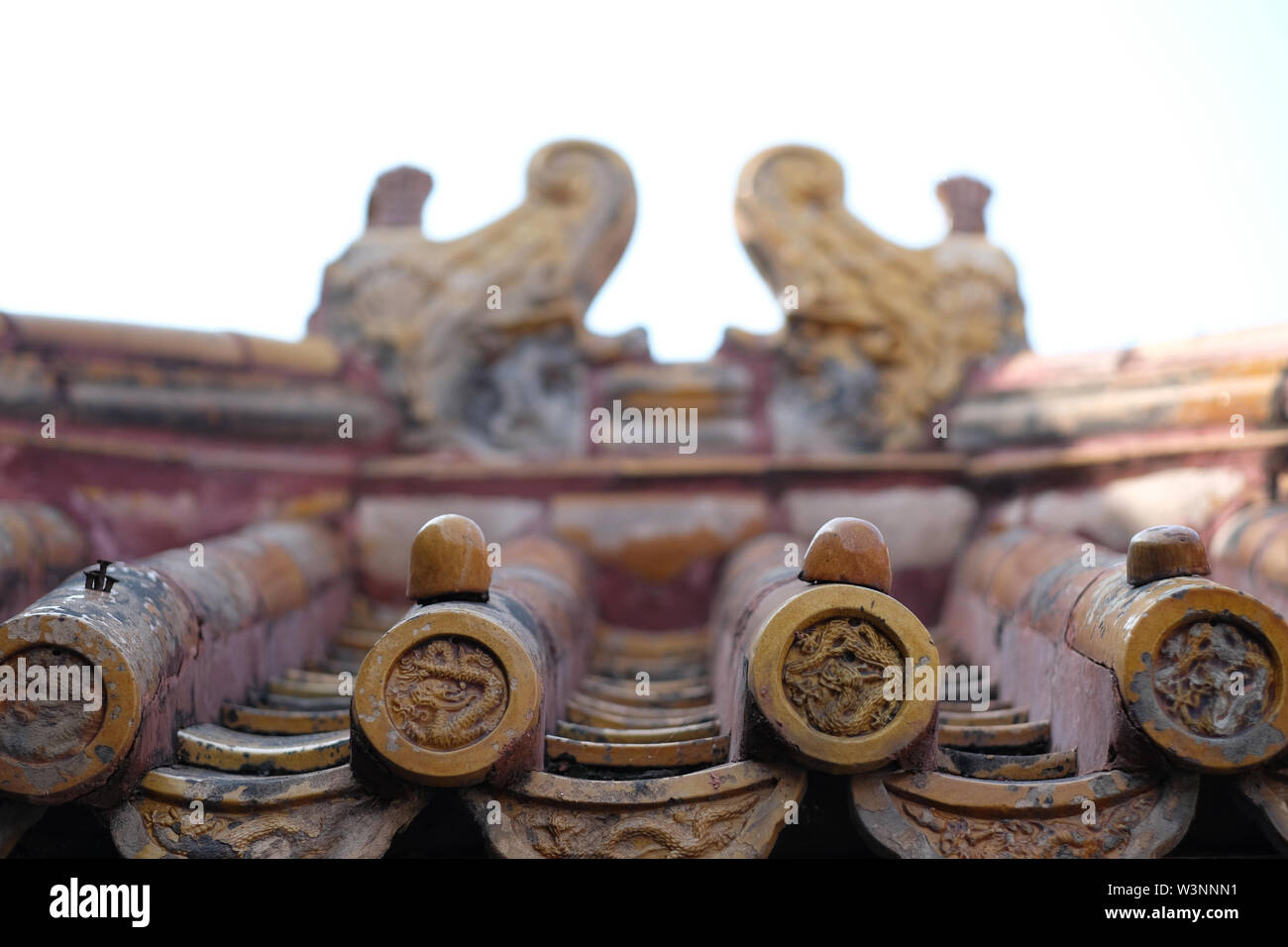 chinese old roof tiles with roof finials and chinese roof tile figures Stock Photo