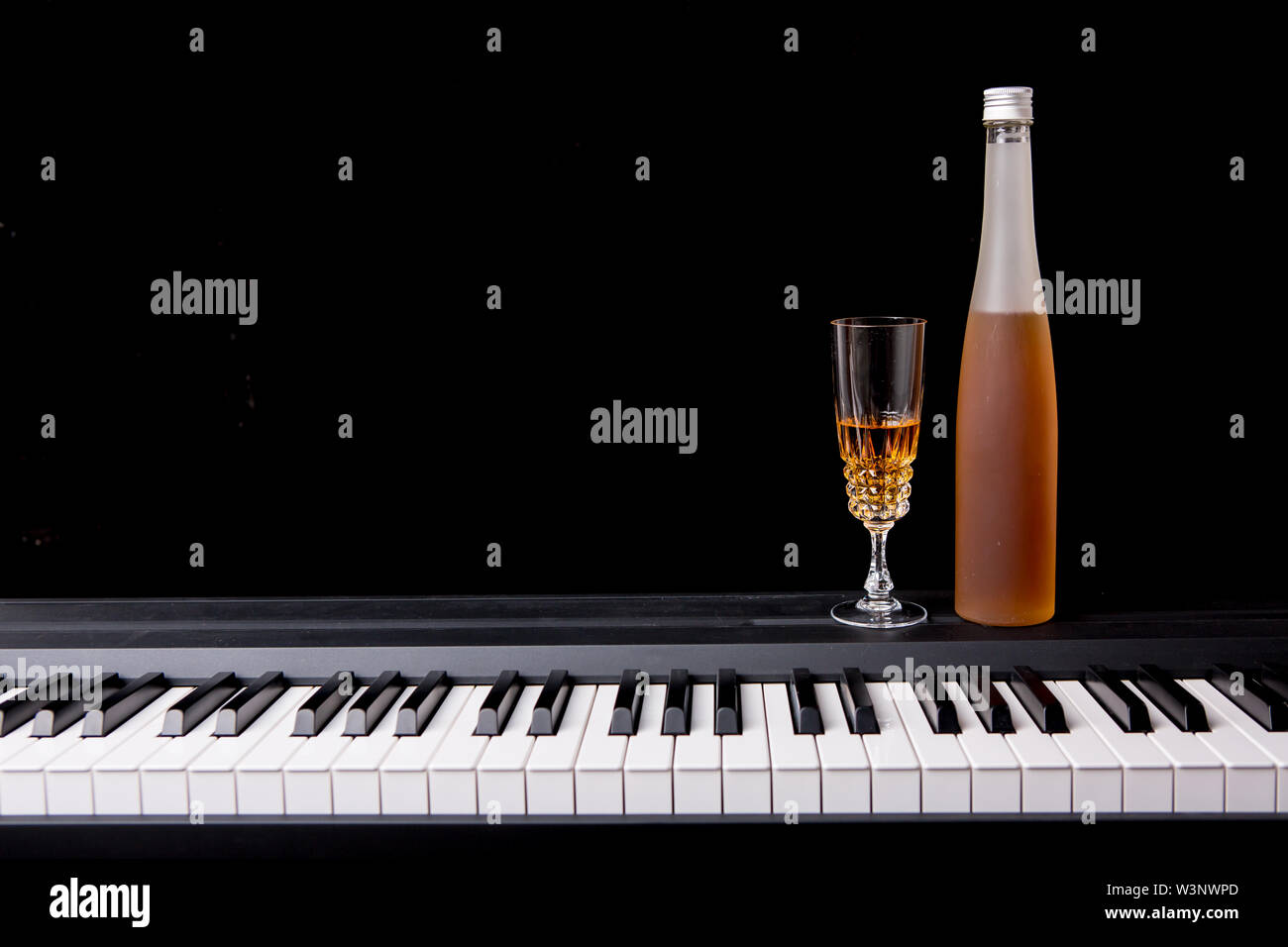 piano with wine glass Stock Photo Alamy