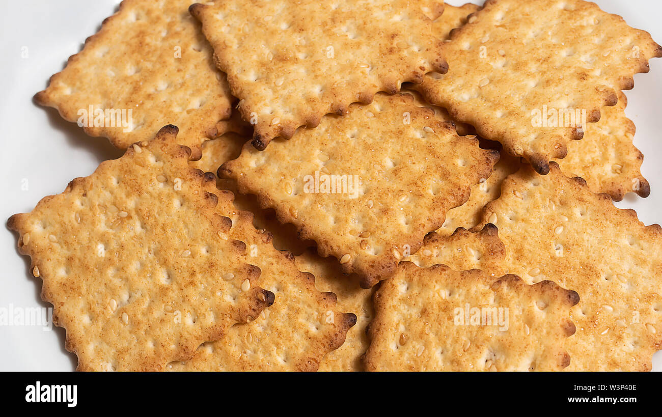 Macro photo of brown dietary lowcalorie crispy cereal cracker with
