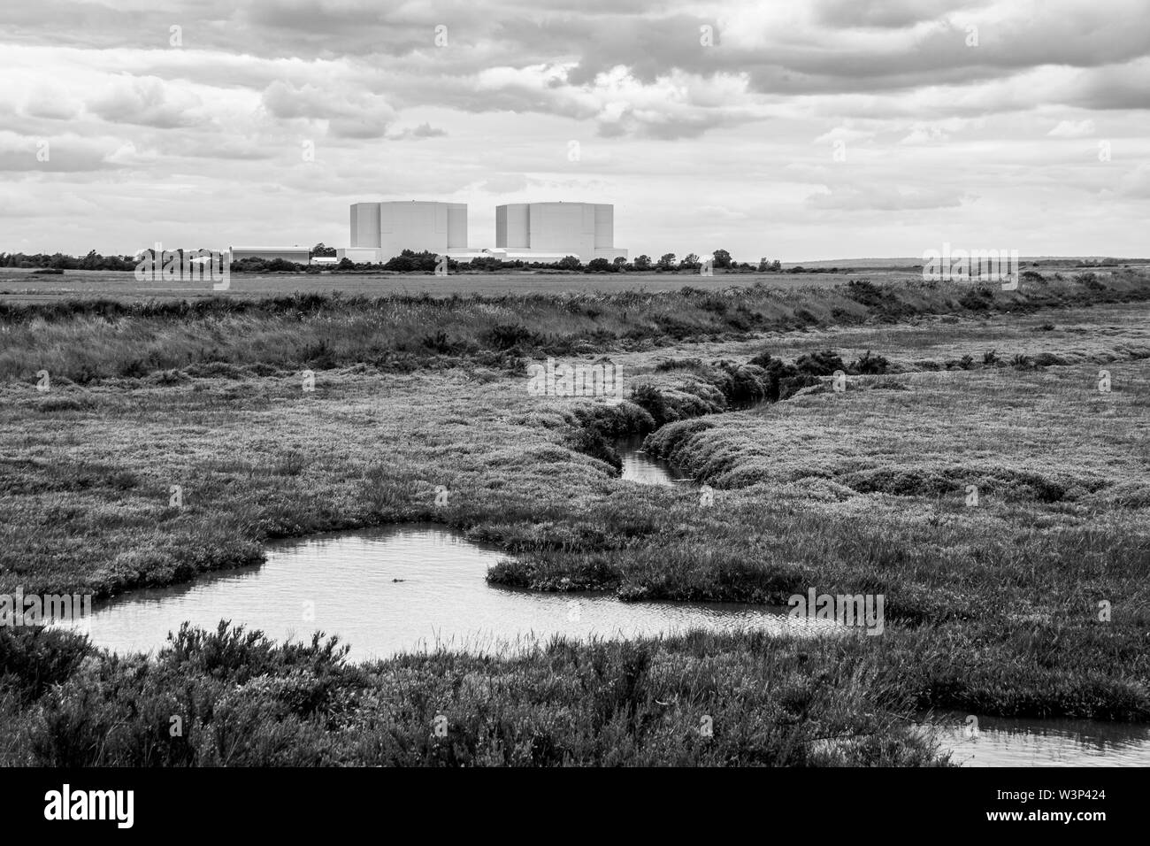 Black and white image from the Dengie Penisula with Bradwell Power Station on the horizon, Bradwell on Sea, Essex Stock Photo