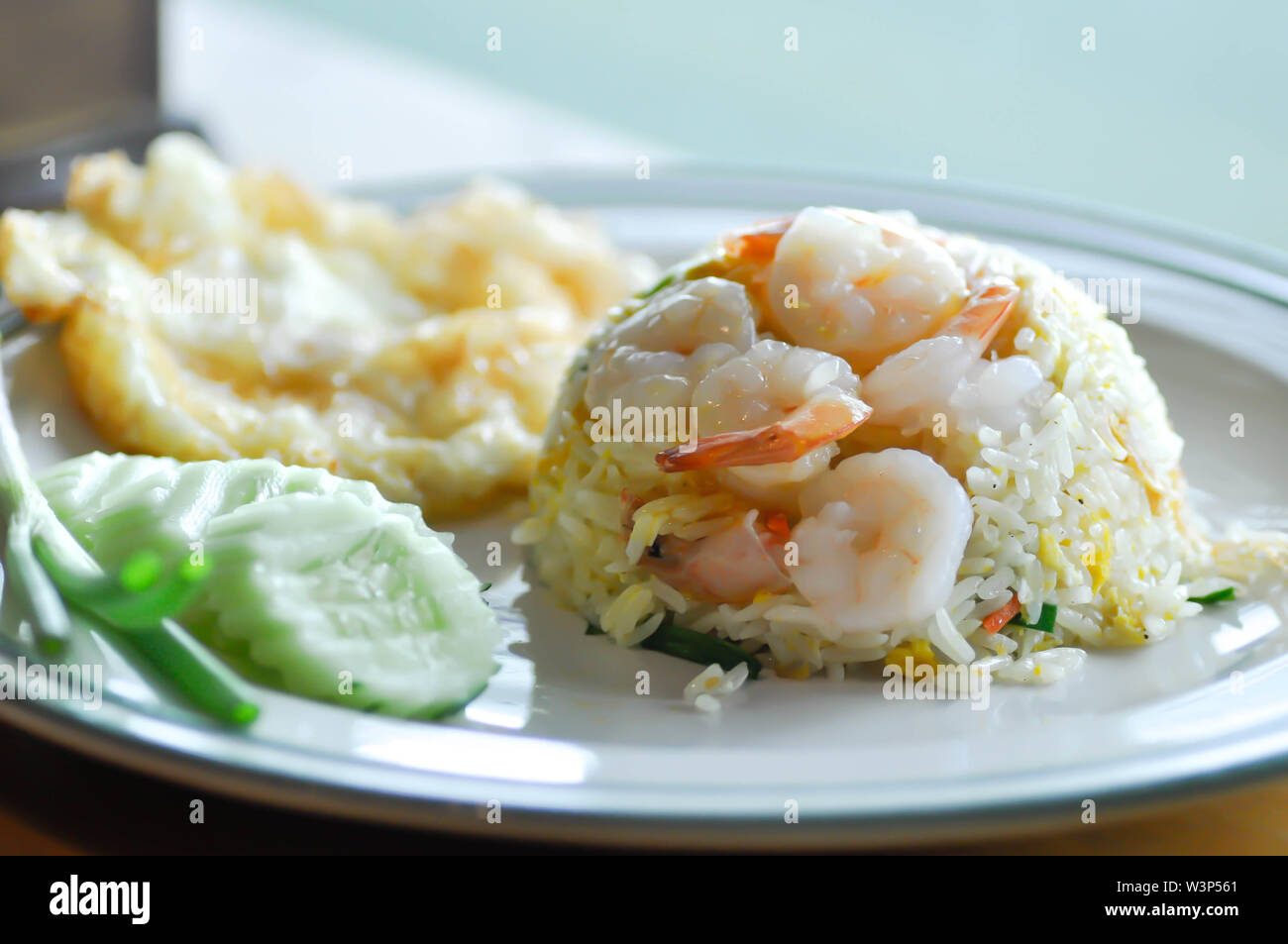 stir-fried rice with shrimp and fried egg and vegetable Stock Photo