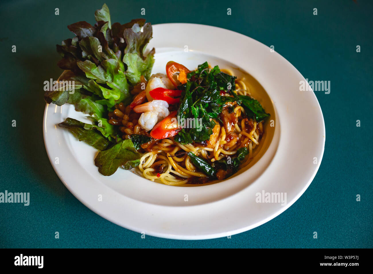 Thompson Submachine Gun and Italian Pasta with Prawns Chili Pepper and  Greens Stock Photo - Image of violence, bandit: 238205410