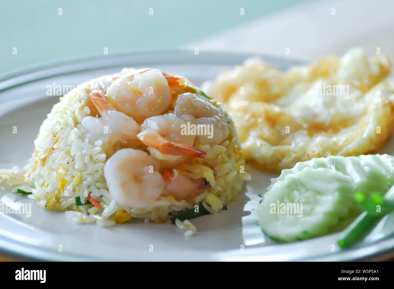 stir-fried rice with shrimp and fried egg and vegetable Stock Photo