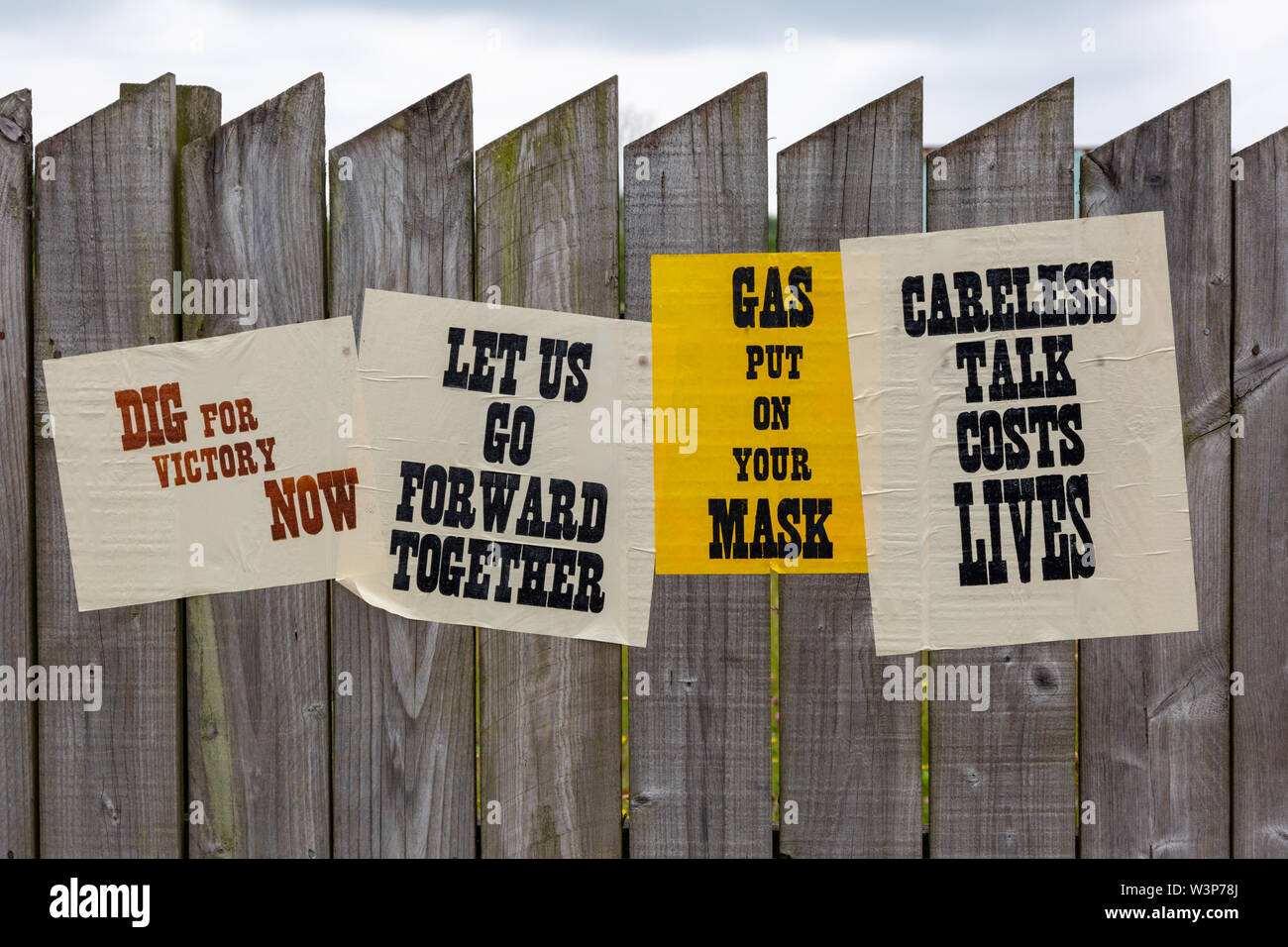 Wartime posters with government advice, on a fence, UK Stock Photo