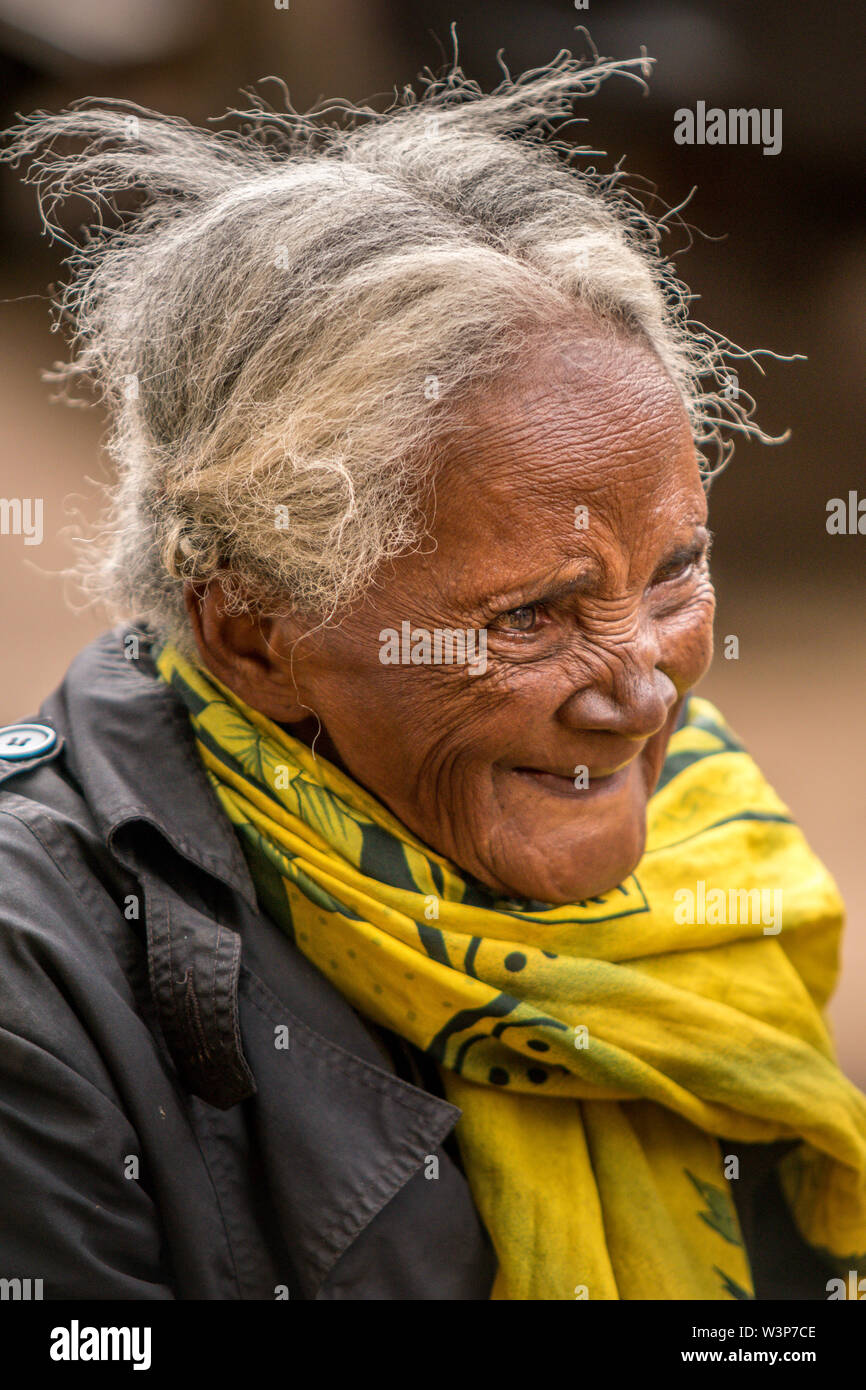 This old lady was waiting after some public transport on a street in  Ambositra, Madagascar, city on the most beautiful road of the country, the  RN7 Stock Photo - Alamy