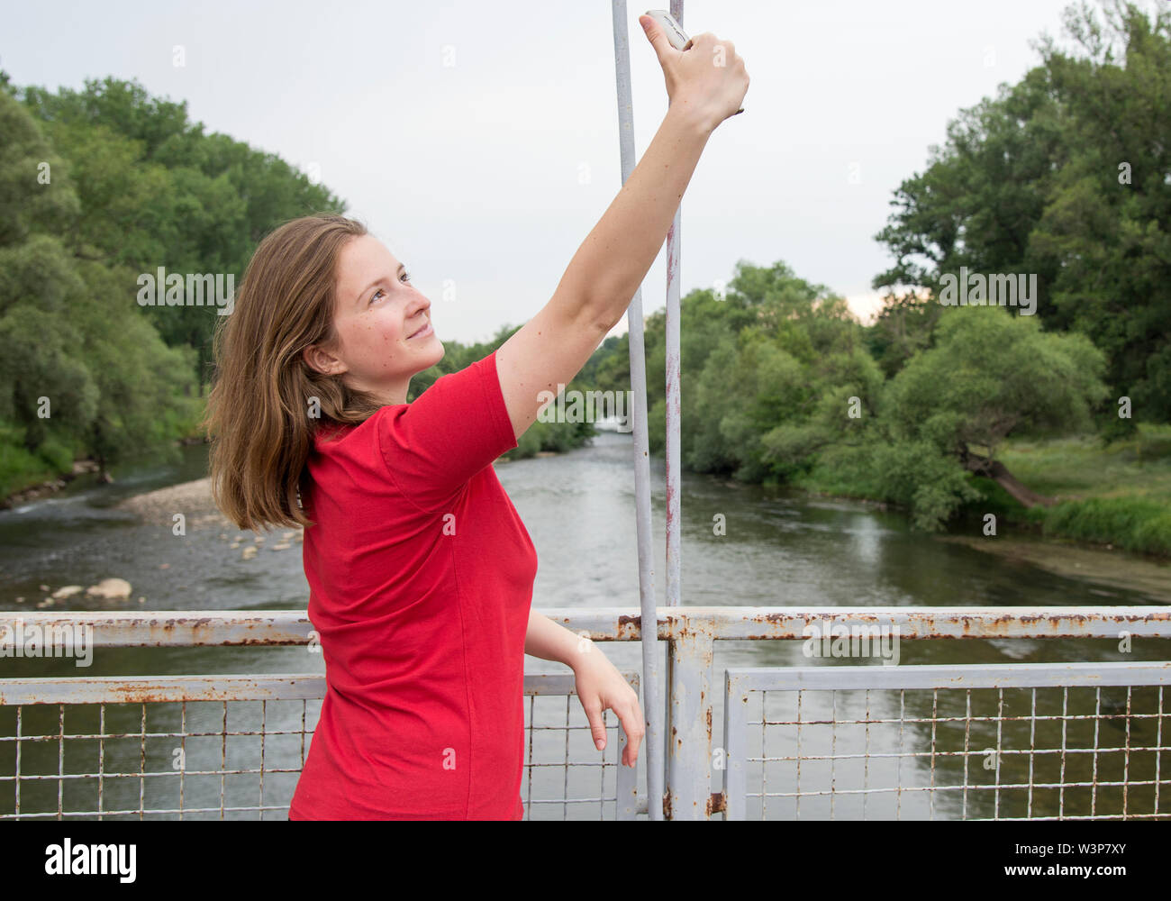 Woman in red shirt hi-res stock photography and images - Alamy